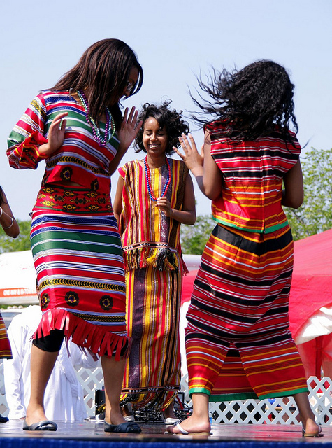 Eritrean girls dancing in traditional outfits. Image by Kurt Bauschardt